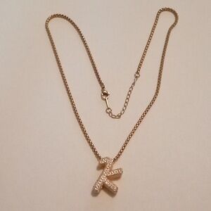#1000.  Gold Toned Chain And Initial K Clear Rhinestone Pendant Necklace
